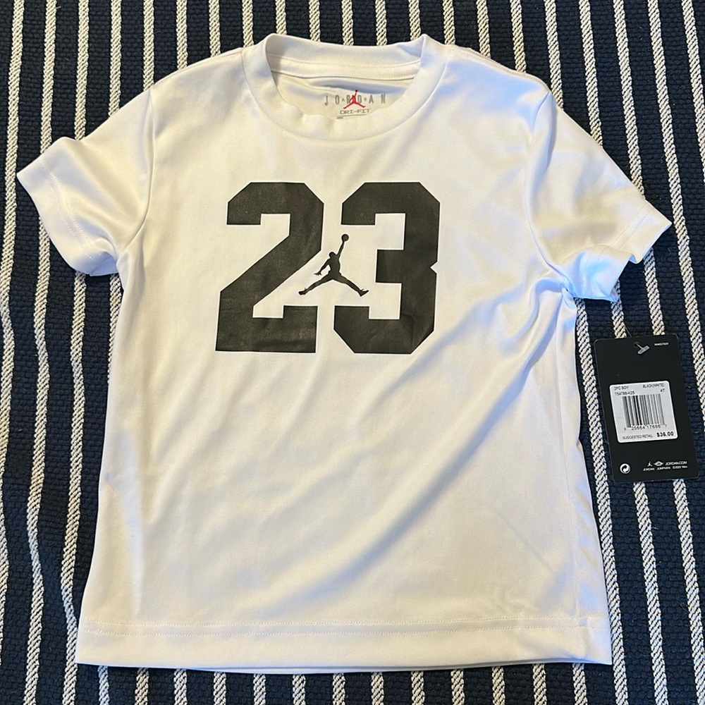 Jordan boys 4T Dri Fit athletic white and black short sleeve shirt.